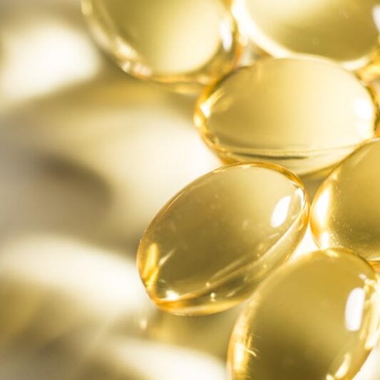 Fish oil tablets macro glowing hplc for vitamin analysis